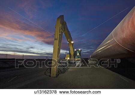 Heavy equipment beside pipeline View Large Photo Image Stock Photo - Heavy equipment beside pipeline. Fotosearch