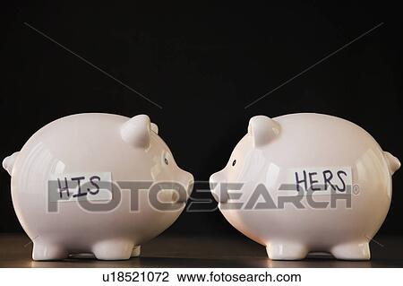 Stock Image - His and hers piggy banks. Fotosearch