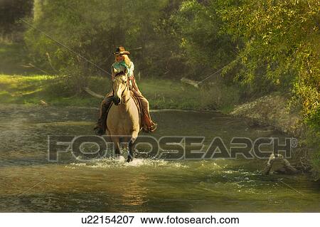 Stock Photo - Horseback rider. Fotosearch