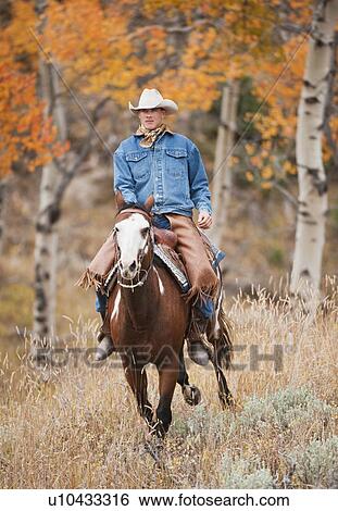 Stock Photograph - Horseback rider. Fotosearch