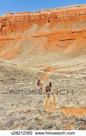 Horseback riders on trail View Large Photo Image Stock Image - Horseback riders on trail. Fotosearch