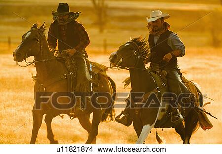 Horseback riders View Large Photo Image Picture - Horseback riders. Fotosearch
