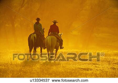 Horseback riders View Large Photo Image Stock Photo - Horseback riders. Fotosearch