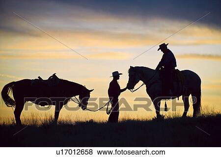 Stock Photo - Horseback riders. Fotosearch