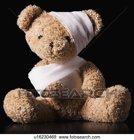 Injured Teddy Bear wrapped in bandage View Large Photo Image Stock Photo - Injured Teddy Bear wrapped in bandage. Fotosearch