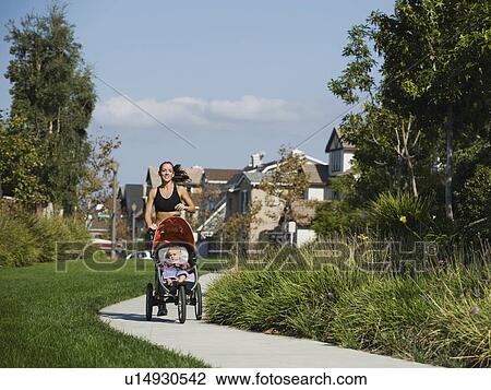 Jogger and baby View Large Photo Image Stock Image - Jogger and baby. Fotosearch