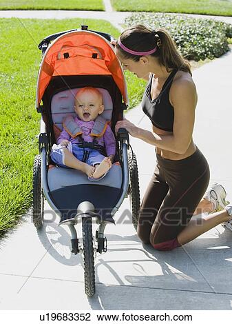 Jogger and baby View Large Photo Image Stock Image - Jogger and baby. Fotosearch
