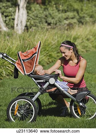Stock Image - Jogger and baby. Fotosearch