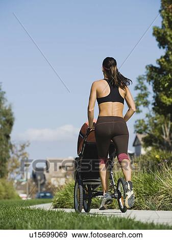 Jogger and baby View Large Photo Image Stock Photo - Jogger and baby. Fotosearch