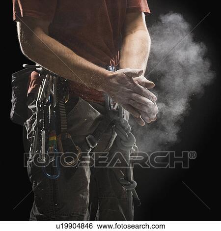 Male climber applying chalk to hands View Large Photo Image Stock Photograph - Male climber applying chalk to hands. Fotosearch