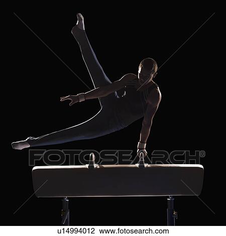 Male gymnast on pommel horse View Large Photo Image Stock Image - Male gymnast on pommel horse. Fotosearch