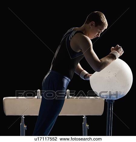Male gymnast on pommel horse View Large Photo Image Stock Image - Male gymnast on pommel horse. Fotosearch