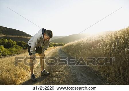 Stock Image - Male jogger resting. Fotosearch