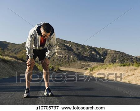 Male jogger resting View Large Photo Image Stock Photo - Male jogger resting. Fotosearch