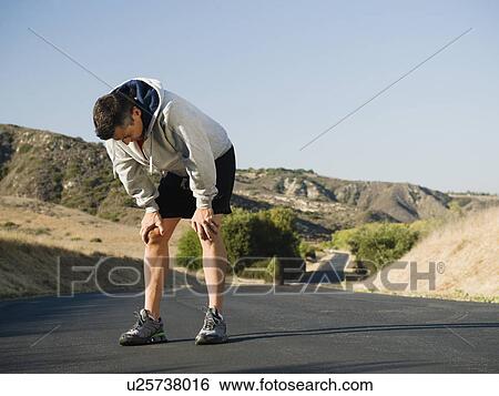 Stock Photograph - Male jogger resting. Fotosearch