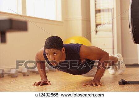 Man doing pushups View Large Photo Image Stock Photography - Man doing pushups. Fotosearch