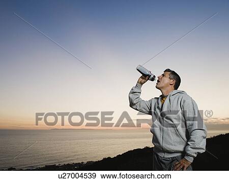 Stock Photo - Man drinking water. Fotosearch