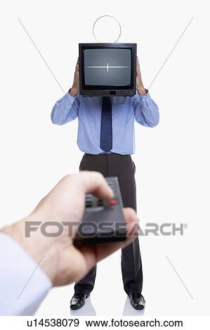 Stock Photo - Man holding television and remote. Fotosearch