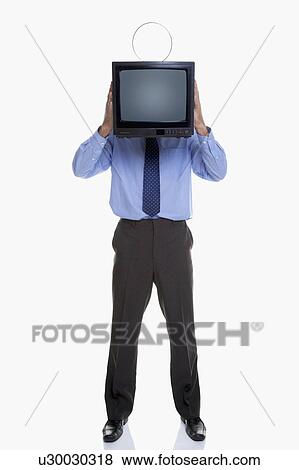 Man holding television in front of face View Large Photo Image Stock Photo - Man holding television in front of face. Fotosearch