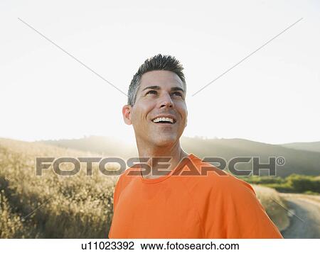 Stock Image - Man looking up. Fotosearch