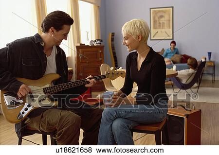 Stock Photo - Man playing electric bass. Fotosearch