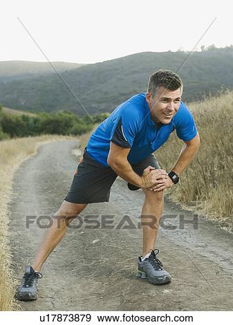 Stock Photo - Man stretching. Fotosearch