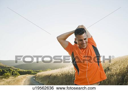 Stock Photograph - Man stretching. Fotosearch