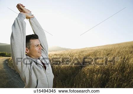 Stock Photography - Man stretching. Fotosearch