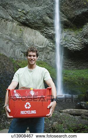 Man with recycling bin View Large Photo Image Stock Photo - Man with recycling bin. Fotosearch
