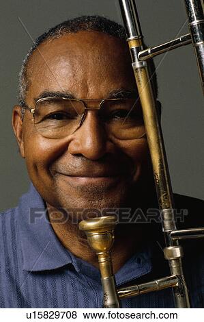 Man with trombone View Large Photo Image Stock Photo - Man with trombone. Fotosearch