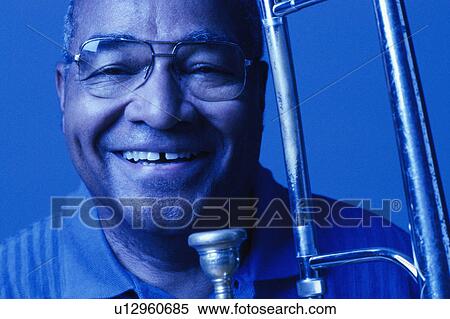 Man with trombone View Large Photo Image Stock Photography - Man with trombone. Fotosearch
