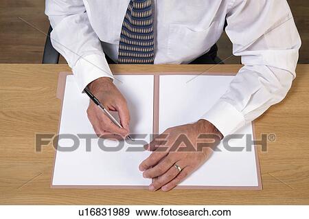 Stock Photo - Man writing document. Fotosearch