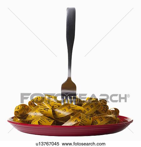 Measuring tape and fork on plate View Large Photo Image Stock Photography - Measuring tape and fork on plate. Fotosearch