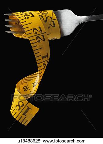 Stock Photography - Measuring tape around fork. Fotosearch