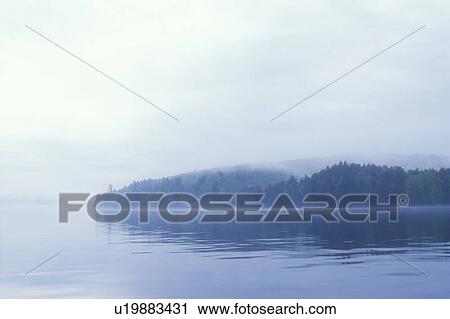 Stock Image - Misty lake. Fotosearch