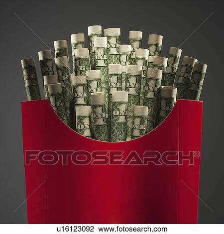 Stock Image - Money in French fry packaging. Fotosearch