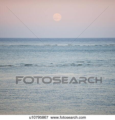 Stock Photo - Moonrise over ocean. Fotosearch