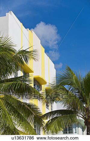 Palm trees and art deco building View Large Photo Image Stock Photograph - Palm trees and art deco building. Fotosearch