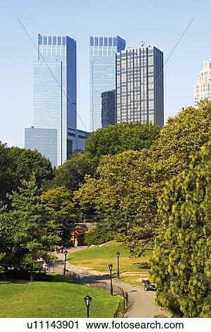Park in front of high-rise buildings View Large Photo Image Stock Image - Park in front of high-rise buildings. Fotosearch