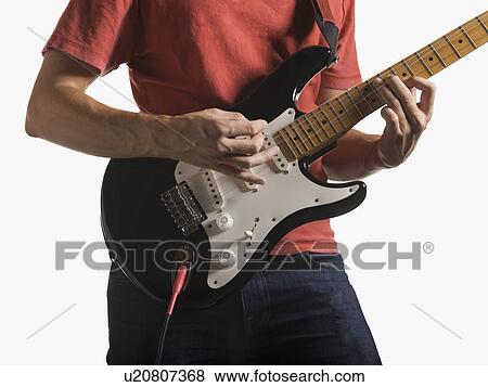 Person playing electric guitar View Large Photo Image Stock Photo - Person playing electric guitar. Fotosearch