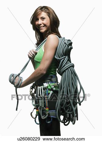 Stock Photo - Portrait of a woman with climbing gear. Fotosearch