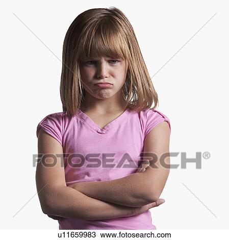 Stock Image - Portrait of angry young girl. Fotosearch