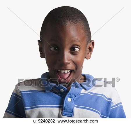 Stock Image - Portrait of boy making silly face. Fotosearch