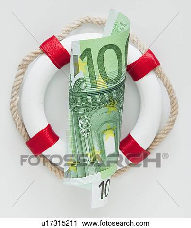 Stock Image - Ring buoy behind European currency. Fotosearch