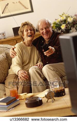 Seniors watching television View Large Photo Image Stock Image - Seniors watching television. Fotosearch