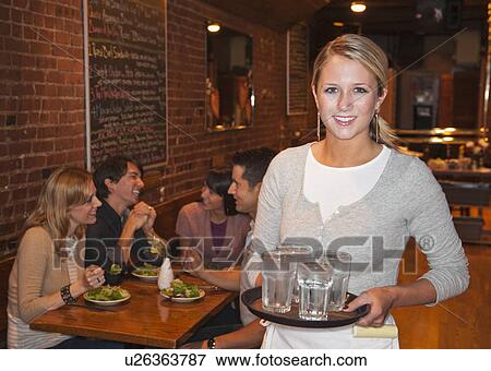 Stock Photo - Server in restaurant. Fotosearch