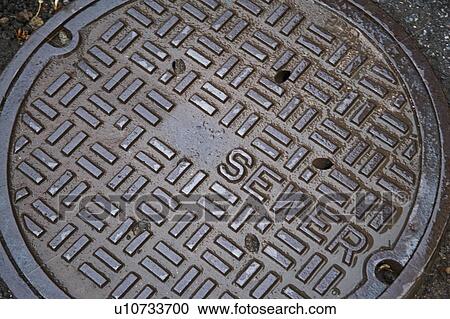 Stock Image - Sewer cover. Fotosearch