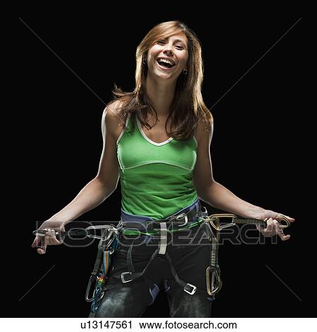 Smiling female climber holding carabiners View Large Photo Image Stock Image - Smiling female climber holding carabiners. Fotosearch