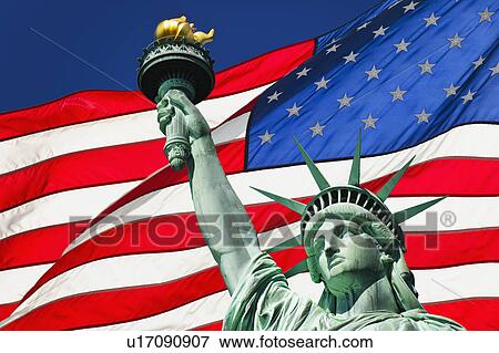 Stock Photo - Statue of liberty and American flag. Fotosearch