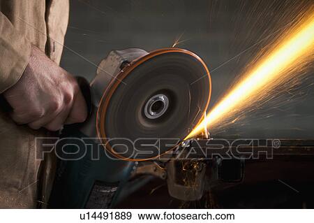 Steel grinder working in metal shop View Large Photo Image Stock Photo - Steel grinder working in metal shop. Fotosearch